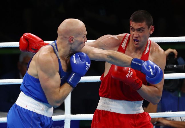 2016 Rio Olympics - Boxing - Final - Men's Heavy (91kg) Final Bout 220 - Riocentro - Pavilion 6 - Rio de Janeiro, Brazil - 15/08/2016. Evgeny Tishchenko (RUS) of Russia and Vassiliy Levit (KAZ) of Kazakhstan compete. REUTERS/Yves Herman FOR EDITORIAL USE ONLY. NOT FOR SALE FOR MARKETING OR ADVERTISING CAMPAIGNS.